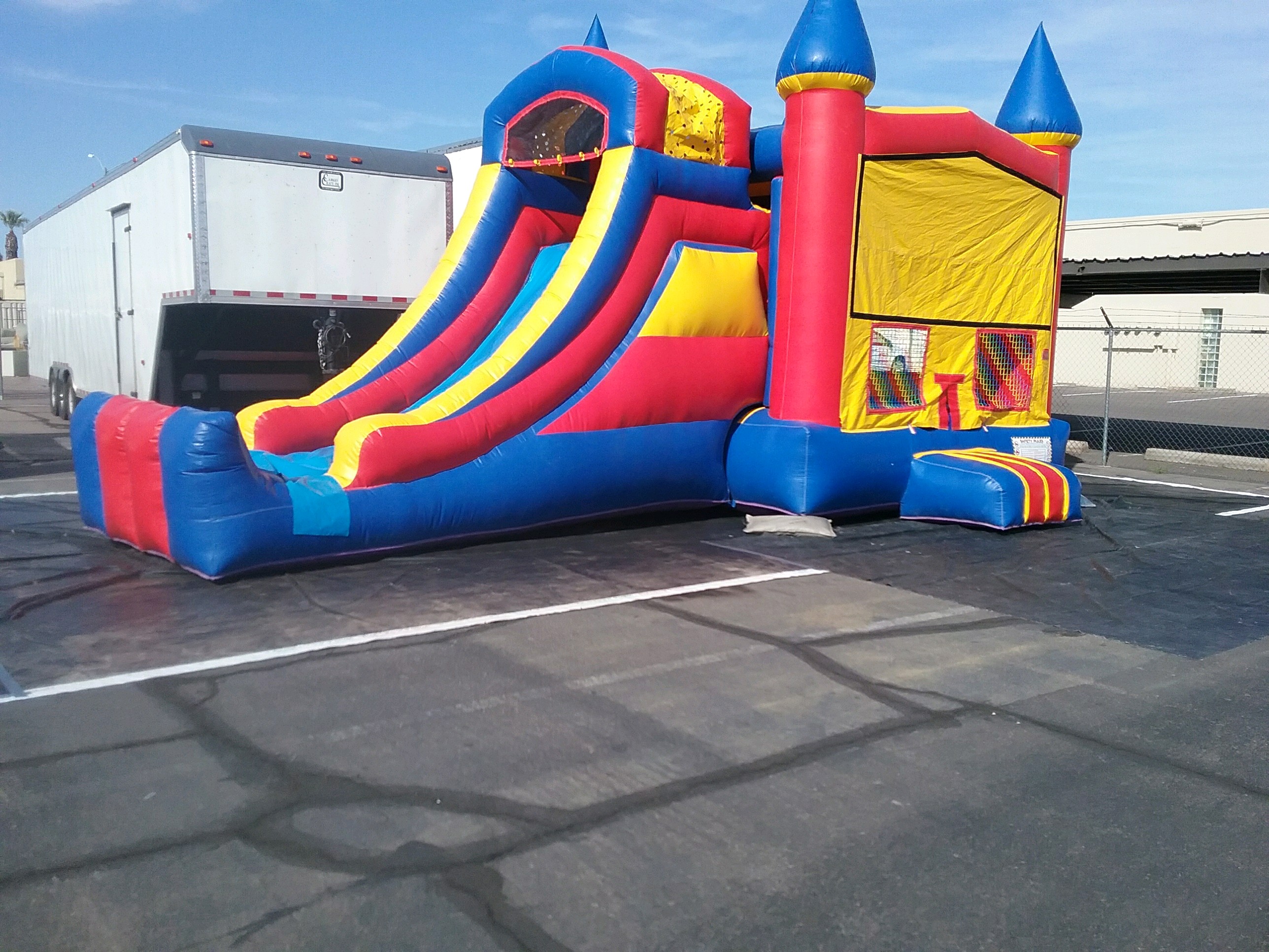 Single lane slide with bounce house