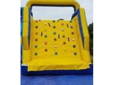 Yellow rock wall with slide