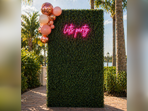 Greenery Backdrop Wall with "Let's Party" Neon Sign