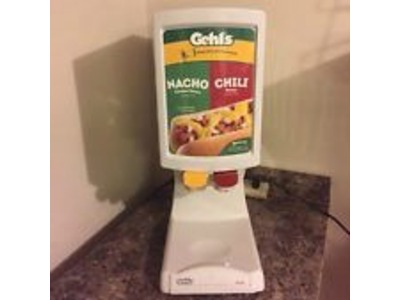 Dual Nacho Machine..includes 1 Bag of Nacho Cheese..2 Bags of Nacho Chips.and 50 Nacho Trays