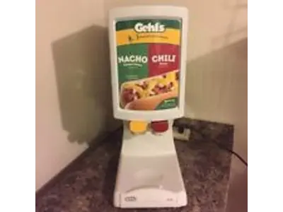 Dual Nacho Machine..includes 1 Bag of Nacho Cheese..2 Bags of Nacho Chips.and 50 Nacho Trays