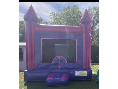 Purple Bounce House in meadow wood